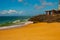 SALVADOR, BAHIA, BRAZIL: Brazilian beach with yellow sand and blue sea in Sunny weather