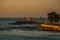 SALVADOR, BRAZIL: Colonial Fort Santa Maria in Barra Salvador Brazil built on tropical beach with palm trees