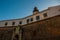 SALVADOR, BRAZIL: Entrance gate. Colorful sign stands in front of the colonial Farol da Barra lighthouse, the oldest in South