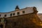 SALVADOR, BRAZIL: Entrance gate. Colorful sign stands in front of the colonial Farol da Barra lighthouse, the oldest in South