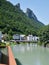 Salzach river, houses in the town of Hallein and rocks above the town, Austria