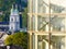 Salzburg/Austria - June 2 2019: Architectural contrast with an old curch towers and a modern building