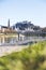 Salzburg spring time: Panoramic city landscape with Salzach with green grass and historic district