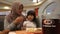 Samarinda, Indonesia, October 12 2020, A&W fast food restaurant, Asian muslim family enjoys meals at A&W, blurred background focus