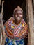 SAMBURU, KENYA - JUNE 25, 2019: Samburu village matriarch wearing colorful beads indicating her rank in the village in