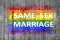 Same sex marriage and LGBT flag painted on background texture gray concrete