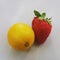 The same size small lemon and big strawberry on neutral background
