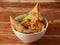 Samosa chaat, Indian special traditional street food served over a rustic wooden background