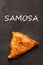 Samosa. Indian cuisine on the black chalkboard