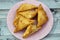 A samosa Singara, a fried South Asian pastry with a Savoury filling including ingredients like spiced potatoes, onions, peas, meat