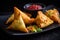 Samosas with a twist stuffed with cheese and jalapenos, served with a side of salsa, on a black plate to create a colorful