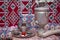 Samovar on a background of carpet . Tea in the tablecloth cups . Copper teapot . Copper bowl . Samovar and teapot