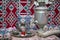 Samovar on a background of carpet . Tea in the tablecloth cups . Copper teapot . Copper bowl . Samovar and teapot