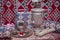 Samovar on a background of carpet . Tea in the tablecloth cups . Copper teapot . Copper bowl . Samovar and teapot