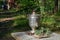 Samovar stands on a wooden table in the garden