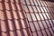 Samples of ceramic roofing tiles in a warehouse of a roofing mat