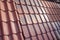 Samples of ceramic roofing tiles in a warehouse of a roofing mat