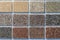 Samples of multi colored plaster for the decoration of the facade and interior of buildings, color palette. Presentation of