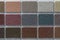 Samples of multi colored plaster for the decoration of the facade and interior of buildings, color palette. Presentation of