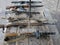 Samples of Soviet automatic weapons of the second world war. Machine guns and machine guns on a wooden table outside on a summer d