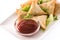 Samsa or samosas with meat and vegetables isolated on white background.