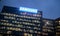 Samsung Headquarters company office building at night with illuminated windows in Milan, Italy