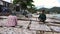 SAMUI, THAILAND, 5 MARCH 2018: Local Thai People Spreading Squids on Net For Drying. Production of Dry Seafood in Samui