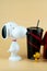 Samut Prakan, Thailand - October 4, 2020 : Set of popcorn bucket and drink cup of cartoon Snoopy and Woodstock toy from Major