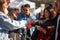 SAN ANTONIO, TEXAS - JANUARY 6, 2018 - Selective focus with accent on hands and cup of people getting coffee during the 2018 Coffe