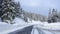 San Bernardino, Switzerland. Driving on a road after a snowfall. Driving shot, driver point of view. POV, vehicle point of view