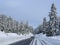 San Bernardino, Switzerland. Driving on a road after a snowfall. Driving shot, driver point of view. POV, vehicle point of view