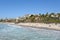 SAN CLEMENTE, CALIFORNIA - 18 OCT 2019: The beach and coastline with surfers and sunbathers seen from the pier in the South Orange