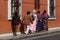 San Cristobal, Mexico - December 27, 2018: Local Mexican women in traditional Indian clothing walk through the streets of the city