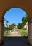 SAN DIEGO, CALIFORNIA - 25 AUG 2021: Arch at Casa del Prado in Balboa Park, looking towards the Botanical Building and Museum of