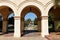 SAN DIEGO, CALIFORNIA - 25 AUG 2021: Arches at Casa del Prado in Balboa Park, looking towards the Botanical Building and Museum of