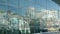 SAN DIEGO, CALIFORNIA USA - 13 FEB 2020: Contemporary Convention Center building, reflection of urban skyline in mirror glass wall