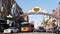 SAN DIEGO, CALIFORNIA USA - 13 FEB 2020: Gaslamp Quarter historic entrance arch sign on 5th avenue. Orange iconic retro trolley,