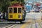 San Francisco, California - Mai 23, 2015: Tourists riding on the iconic cable car clear sunny, blue sky day at top of Hyde Street
