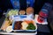 SAN FRANCISCO, CALIFORNIA, UNITED STATES - NOV 24th, 2018: Hot food served on board of economy class airplane on table