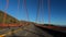 San Francisco California USA - January 2020. Slow motion Driving famous Golden Gate Bridge , no clouds blue clear sky