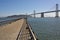San Francisco promenade Bay bridge and Pacific ocean.