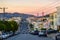 San Francisco Skyline with Residential Neighborhood, Crooked Street and The Golden Gate Bridge at Sunset