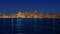 San Francisco sunset skyline in California with reflection in bay water