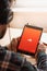 SAN FRANCISCO, US - 1 April 2019: Young man enjoying his favorite music, using Marshal headphones, in San Francisco, California,