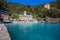 San Fruttuoso di Camogli, Ligurian coast, Genoa province, with its ancient Abbaey, the beach and tourists, Italy