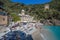 San Fruttuoso di Camogli, Ligurian coast, Genoa province, with its ancient Abbaey, the beach and tourists, Italy