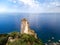 San Gemiliano fortress tower on the rocky coast on the blue sea. Sardinia, Italy. City of Arbatax