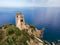 San Gemiliano fortress tower on the rocky coast on the blue sea. Sardinia, Italy. City of Arbatax