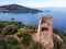 San Gemiliano fortress tower on the rocky coast on the blue sea. Sardinia, Italy. City of Arbatax