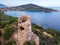 San Gemiliano fortress tower on the rocky coast on the blue sea. Sardinia, Italy. City of Arbatax